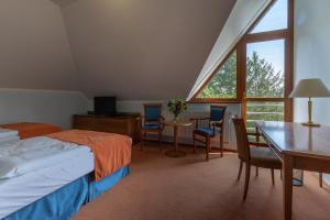 Posteľ alebo postele v izbe v ubytovaní Darovanský Dvůr - Wellness & Golf Hotel