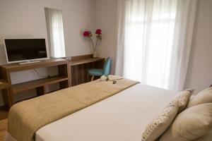 Ένα ή περισσότερα κρεβάτια σε δωμάτιο στο Pradaria Asador & Alojamiento