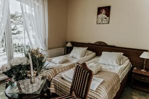 Ένα ή περισσότερα κρεβάτια σε δωμάτιο στο Chimera Spa Niechorze