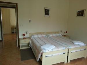 Кровать или кровати в номере Hotel Bodoni