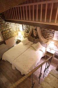 Postel nebo postele na pokoji v ubytování Castillo de Piedrasecha