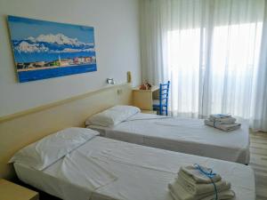 Posteľ alebo postele v izbe v ubytovaní Hotel Souvenir