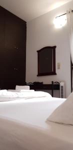Gompos Apartment - Cozy Apartment next to the sea - Amazing Sea View客房内的一张或多张床位