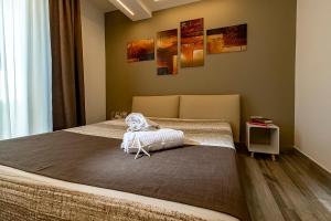 Postel nebo postele na pokoji v ubytování Sundeck Hotel