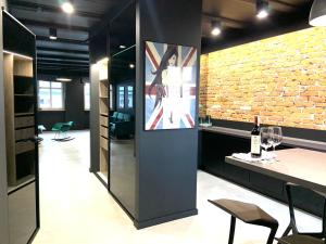 a wine tasting room with a brick wall at 5 Star Apartments - Luxury & Comfort in Jelenia Góra