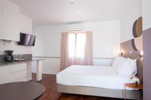 Lisbon Serviced Apartments - Campos客房内的一张或多张床位