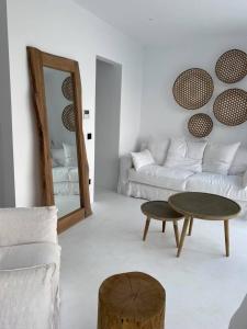 a living room with a couch and a table at The Cove Sivota Bay in Sivota