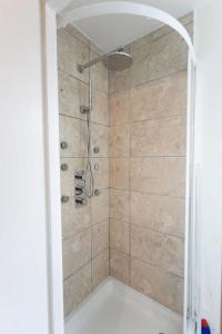 a bathroom with a shower with a glass door at TownHouse4bedRoomHouse in West Dulwich