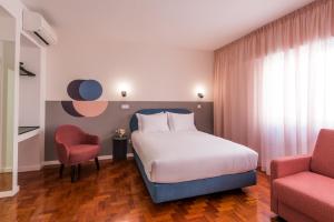 Lisbon Serviced Apartments - Campos客房内的一张或多张床位