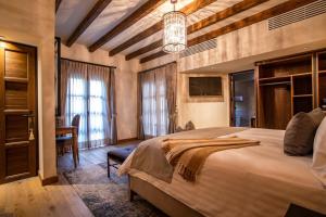 Postel nebo postele na pokoji v ubytování Hotel Apapacho Boutique + 37 fotografií