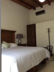 Postel nebo postele na pokoji v ubytování Hotel Concierge Flor y Canto