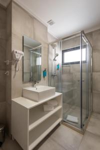 a bathroom with a sink and a shower at Lisbon Serviced Apartments - Campos in Lisbon