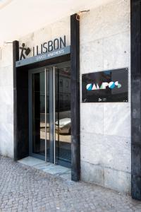 a building with a television on the front of it at Lisbon Serviced Apartments - Campos in Lisbon