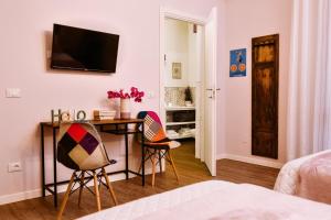 Postel nebo postele na pokoji v ubytování La Bicicletta Rooms