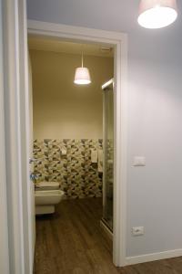 Postel nebo postele na pokoji v ubytování La Bicicletta Rooms
