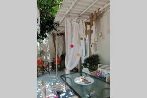 a room with a glass table with a plate on it at Beautiful House with Garden in Heraklio