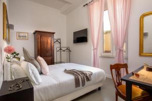 Posteľ alebo postele v izbe v ubytovaní Guesthouse Serafino