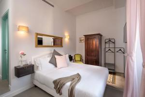 Posteľ alebo postele v izbe v ubytovaní Guesthouse Serafino
