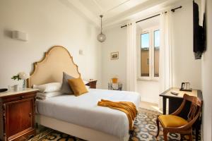 Posteľ alebo postele v izbe v ubytovaní Guesthouse Serafino