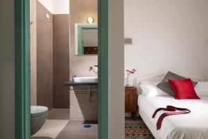 Posteľ alebo postele v izbe v ubytovaní Guesthouse Serafino