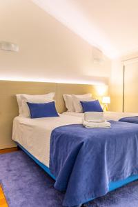 Postel nebo postele na pokoji v ubytování Aldeia Azul Resort + 28 fotografií