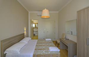 Postel nebo postele na pokoji v ubytování Hotel La Pace