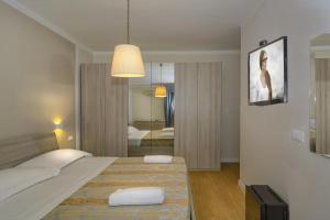 Postel nebo postele na pokoji v ubytování Hotel La Pace