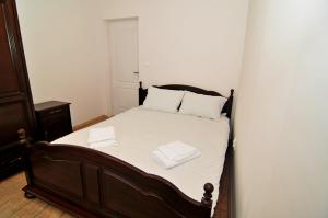 Ένα ή περισσότερα κρεβάτια σε δωμάτιο στο Apartament 7 Central