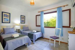 A bed or beds in a room at Villa Gotmar by Sealand Villas