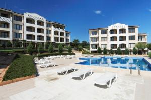 a hotel with a swimming pool and two buildings at View Apartments in Sozopol