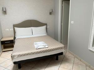 Voodi või voodid majutusasutuse Hotel Lo Scudiero toas