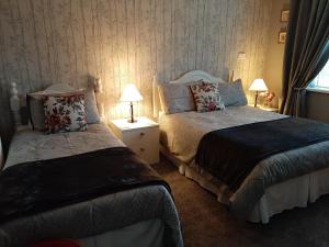سرير أو أسرّة في غرفة في Barrow View Accommodation