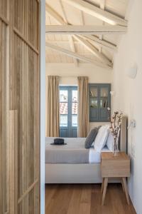 A bed or beds in a room at NESEA Boutique Apartments