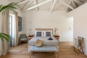 A bed or beds in a room at NESEA Boutique Apartments