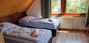 Posteľ alebo postele v izbe v ubytovaní Mátraszentimre Panzió