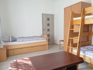 Postel nebo postele na pokoji v ubytování Penzion a hospůdka U Anny