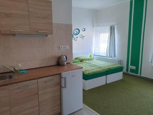 Postel nebo postele na pokoji v ubytování Penzion a hospůdka U Anny