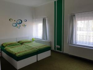Postel nebo postele na pokoji v ubytování Penzion a hospůdka U Anny