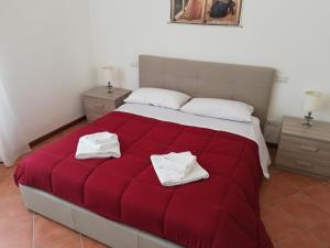 A bed or beds in a room at Casa di Pietro Aretino, Arezzo Centro Storico 4-8 letti
