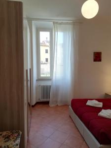 A bed or beds in a room at Casa di Pietro Aretino, Arezzo Centro Storico 4-8 letti