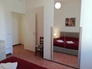 A bed or beds in a room at Casa di Pietro Aretino, Arezzo Centro Storico 4-8 letti