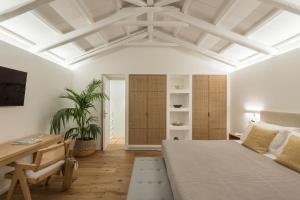 A bed or beds in a room at NESEA Boutique Apartments