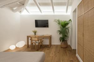 A television and/or entertainment centre at NESEA Boutique Apartments