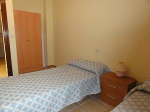 Posteľ alebo postele v izbe v ubytovaní Apartamento Playa Langosteira