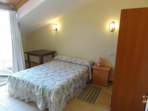 Posteľ alebo postele v izbe v ubytovaní Apartamento Playa Langosteira