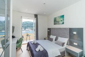Postel nebo postele na pokoji v ubytování Art Hotel Dubrovnik