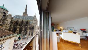 a room with a view of a city from a window at Amazing View_Loft Apartment in the heart of Vienna in Vienna