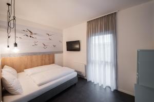 Postel nebo postele na pokoji v ubytování Lakeside77