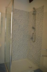 a bathroom with a shower with a glass door at Da zia Rosina in Lamezia Terme +15 photos