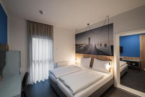 Postel nebo postele na pokoji v ubytování Lakeside77